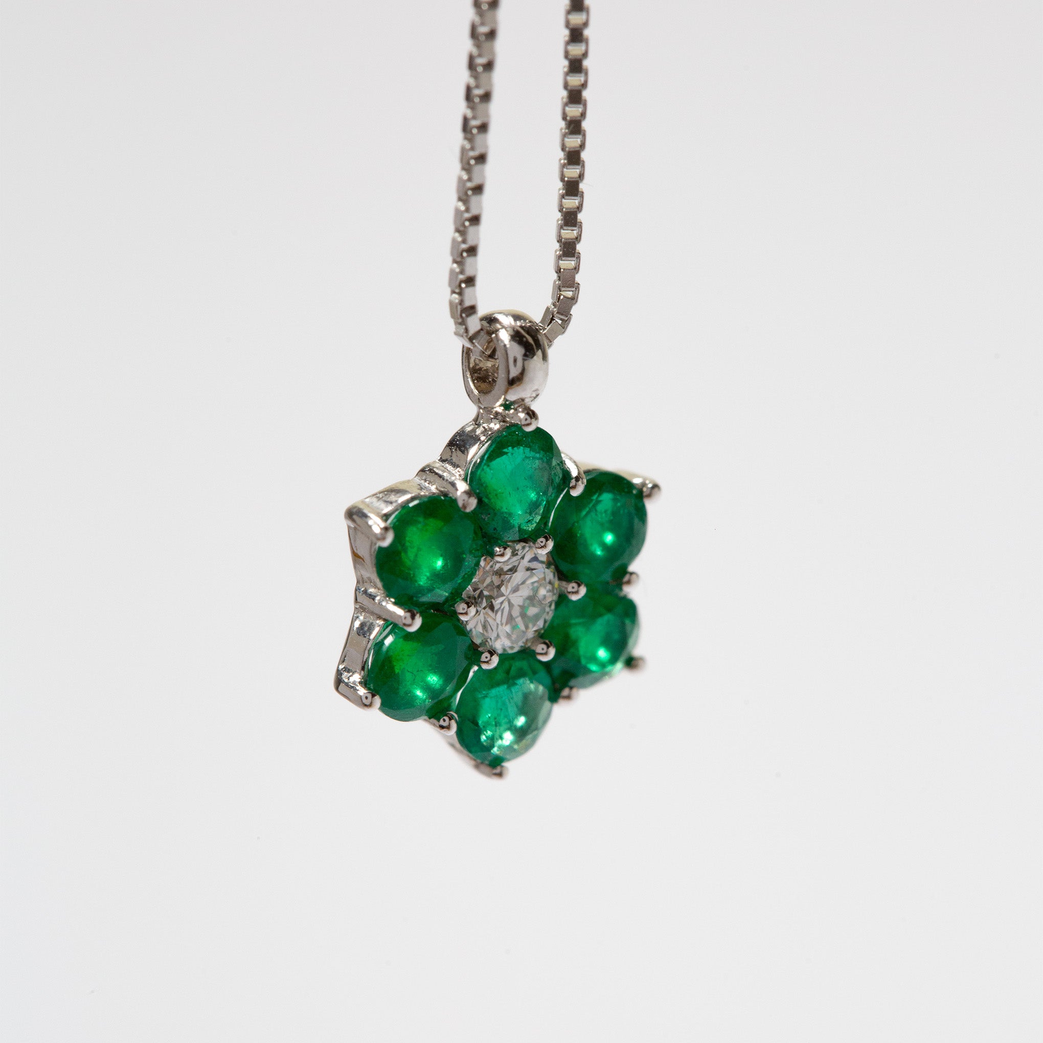 Colombian emerald and diamond pendant necklace by Smeralco, elevating the look with exclusivity and luxury, for an event at Royal Ascot, London. Exclusive luxury jewelry