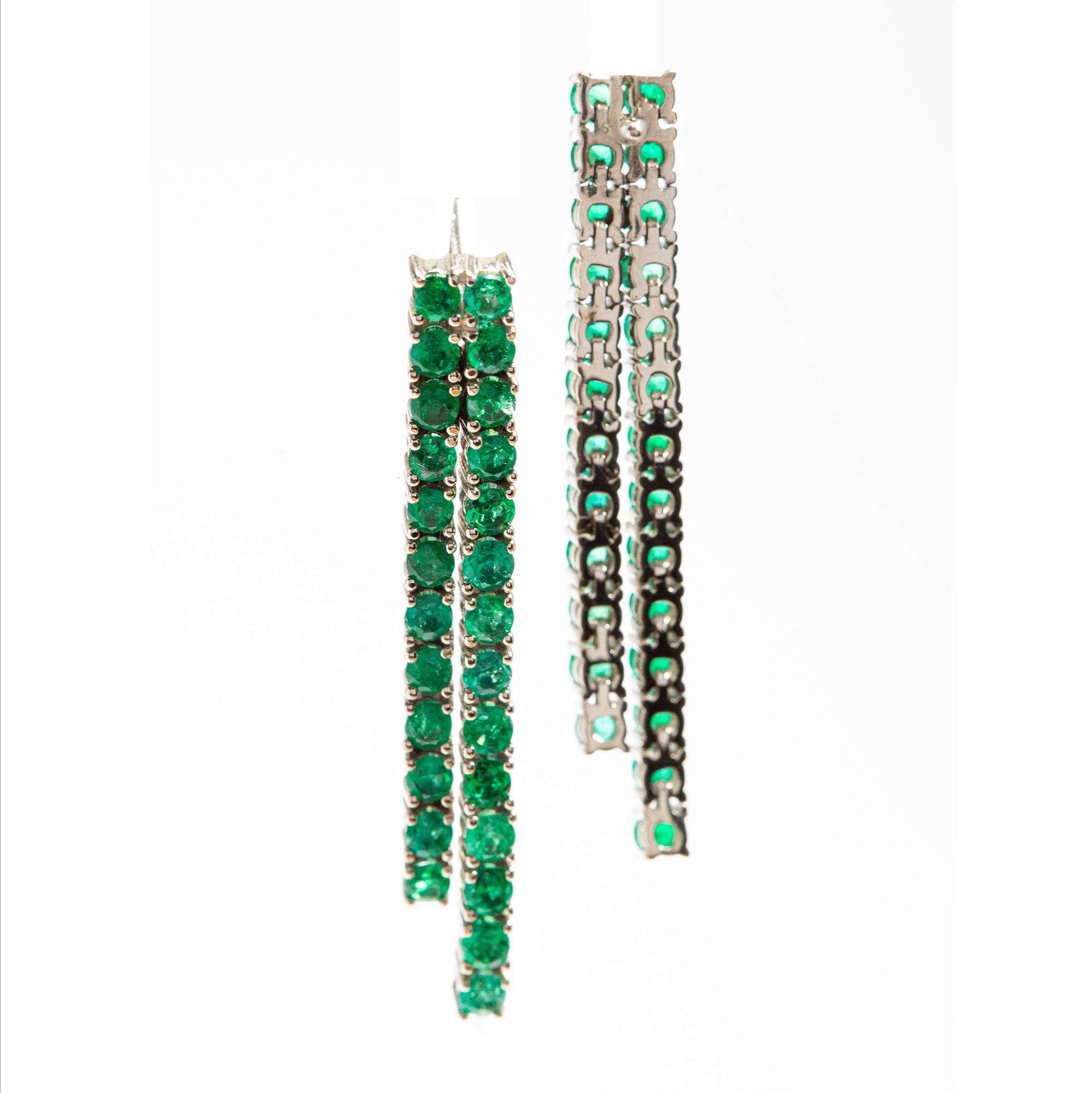 Smeralco's gold earrings with Colombian emeralds and diamonds, highlighted at Miami Bar Association, offering timeless sophistication and elite charm