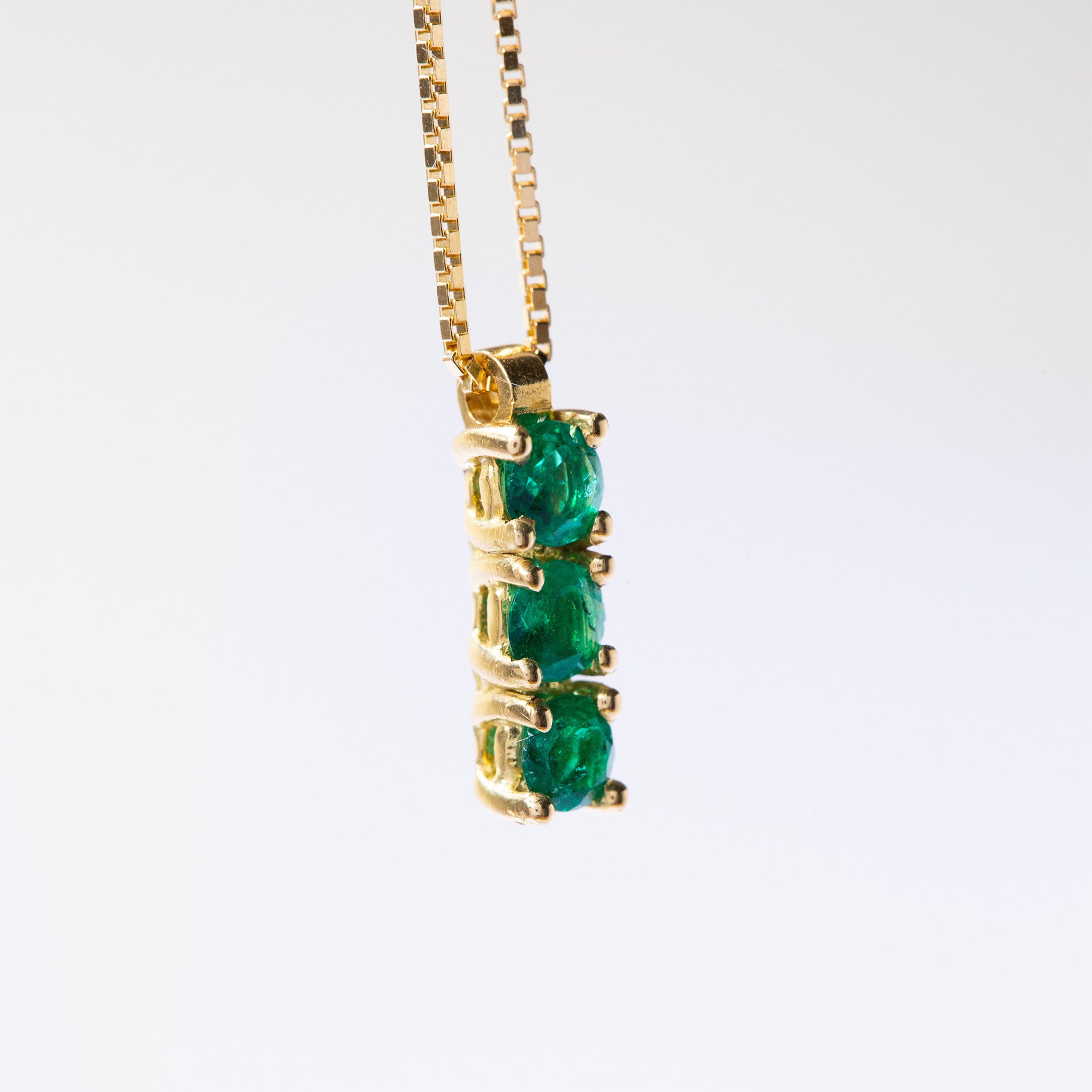 Elevate your image with the gold Colombian emerald and diamond pendant necklace by Smeralco, luxury and exclusive jewelry for Houston's legal elite