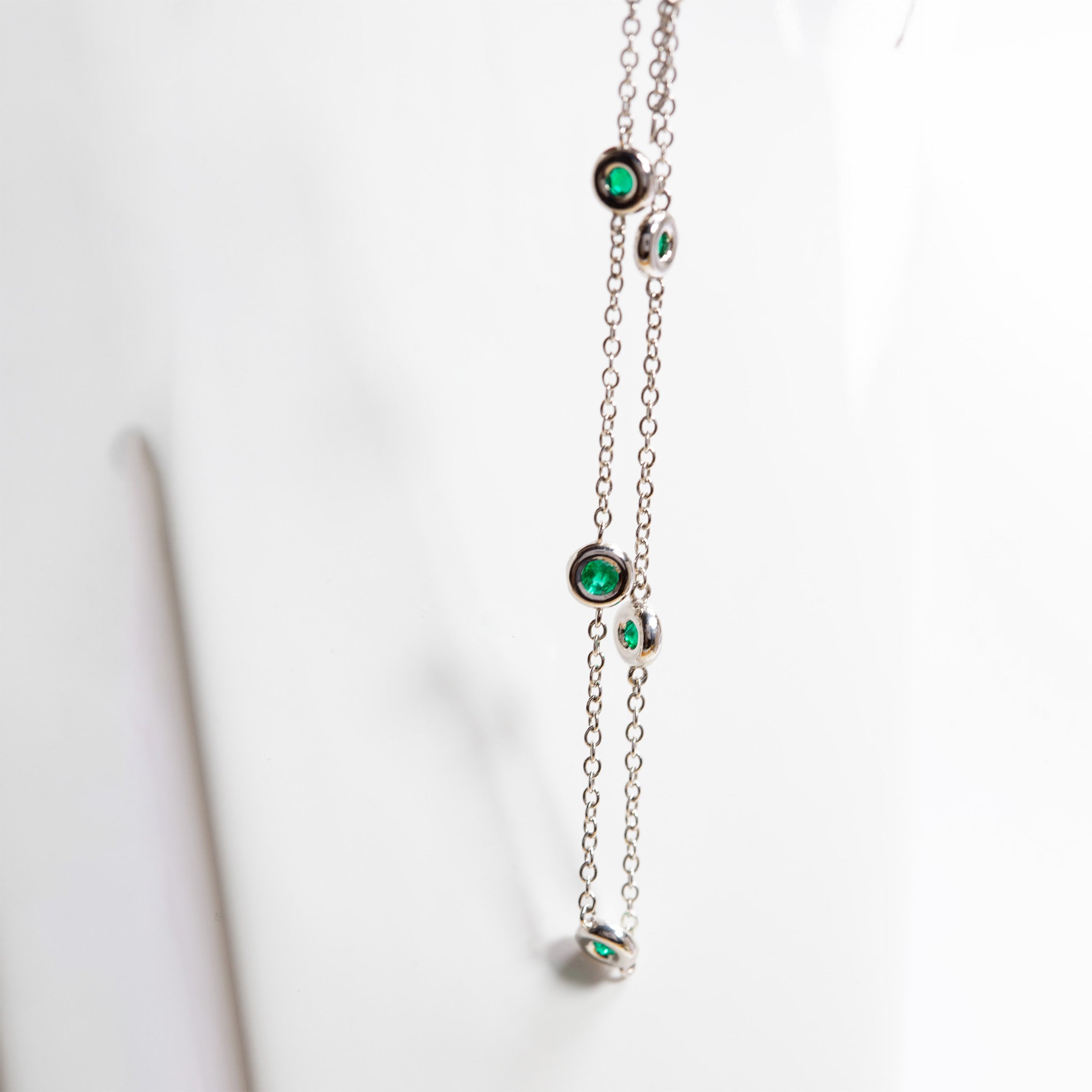 Smeralco's iconic gold pendant necklace with Colombian emerald and diamonds, featured at Wimbledon London, showcasing unparalleled elegance and artisanal mastery