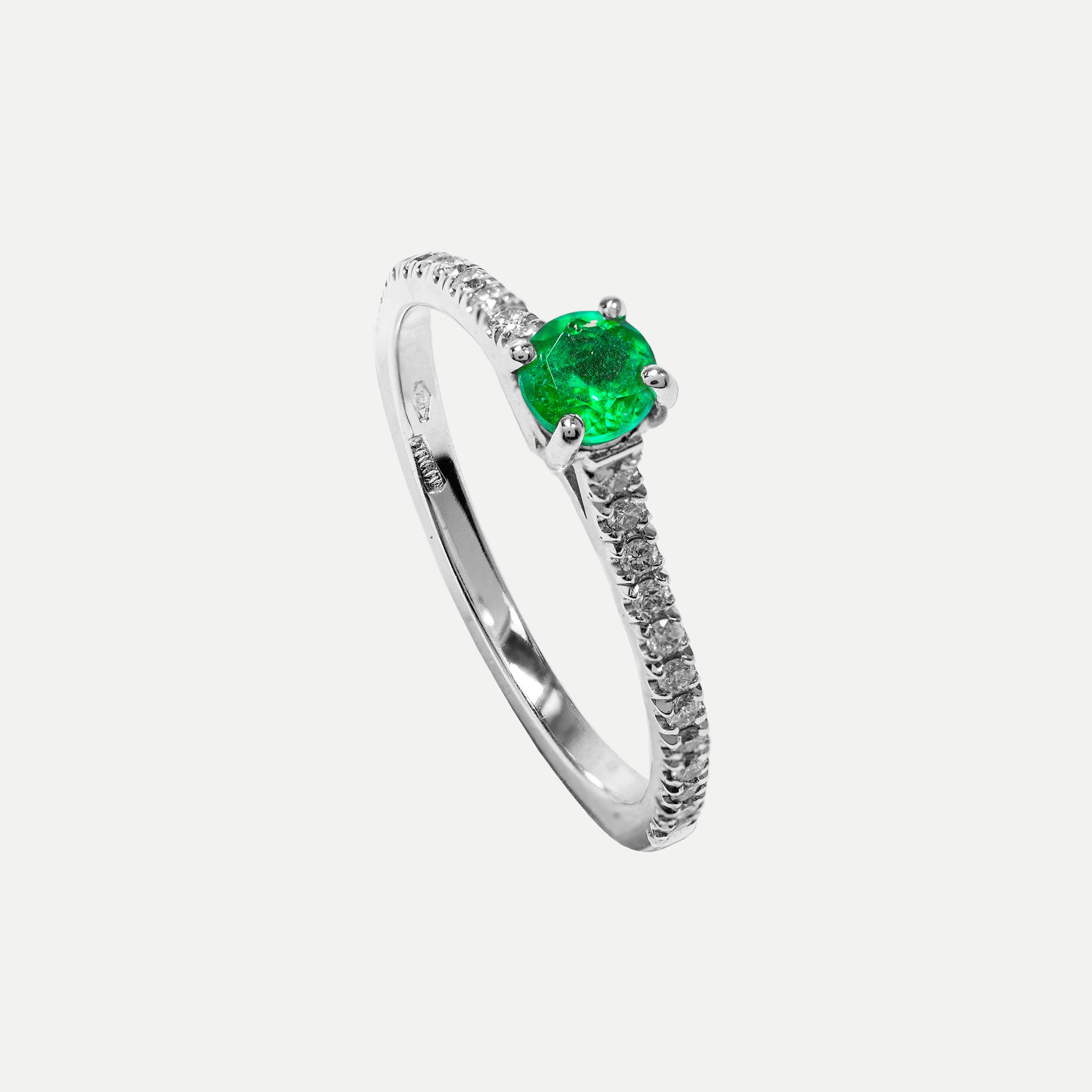 Gold emerald engagement ring from Smeralco, showcasing luxury and exclusivity, displayed at Wimbledon, London. High-end jewelry