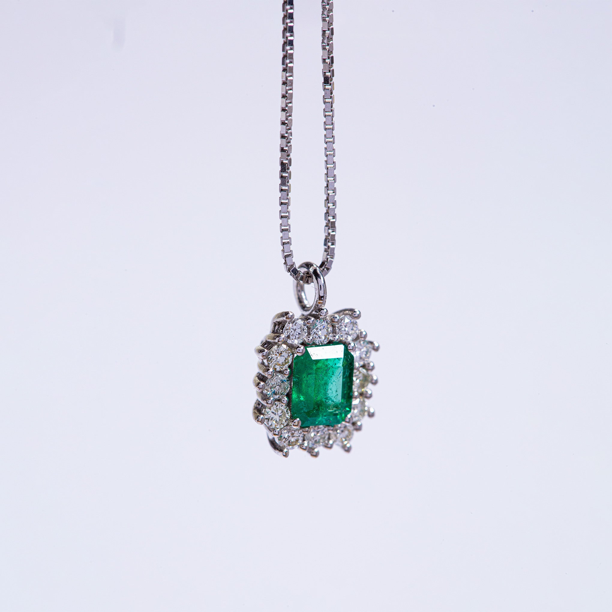Smeralco's gold pendant necklace with Colombian emerald and diamonds, featured at Legal London, showcasing exquisite craftsmanship and unrivaled elegance